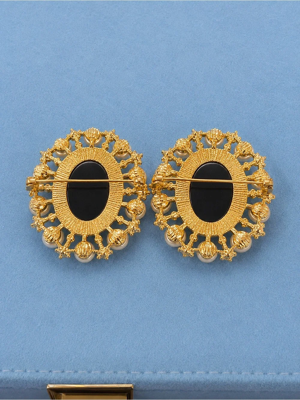 2 Vintage-Inspired Cameo brooches. 1 back one dark blue